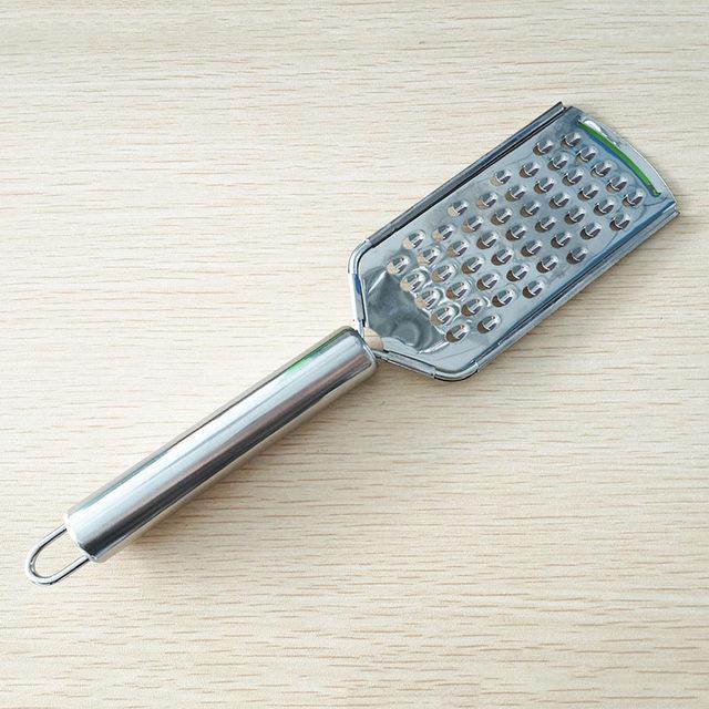 https://www.rosettascountrykitchen.com/cdn/shop/products/multifunction-stainless-steel-cheese-lemon-zester-fruit-peeler-shredder-microplane-grater-3_1024x1024@2x.jpg?v=1611530938